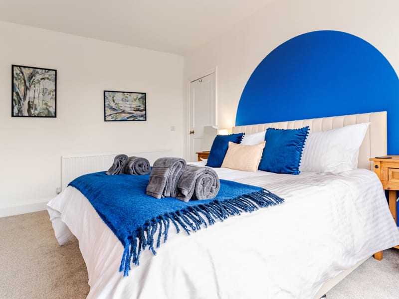 Bedroom 1 dressed as a superking with towels laid out